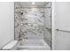 Clean bathroom with marble tile shower and bathtub at 1308 E Columbus Dr # 4, Tampa, FL 33605