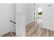 Bright hallway with light wood flooring and staircase at 1308 E Columbus Dr # 4, Tampa, FL 33605