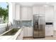 Modern kitchen features stainless steel appliances and granite countertops at 1308 E Columbus Dr # 4, Tampa, FL 33605