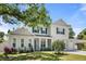 Two-story home with white siding, gray shutters, and a covered porch at 4010 W Watrous Ave, Tampa, FL 33629