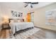Serene main bedroom with natural light, decorative accents, and access to a bathroom with sliding door at 4304 W Laurel St, Tampa, FL 33607