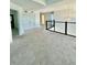 Upstairs hallway with carpeted floors and access to bedrooms at 12964 Willow Grove Dr, Riverview, FL 33579
