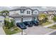 Two-story house with a three-car garage and paver driveway at 12964 Willow Grove Dr, Riverview, FL 33579