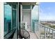 A scenic balcony with seating overlooks the city and ocean, with a dining area just inside the glass doors at 777 N Ashley Dr # 2601, Tampa, FL 33602