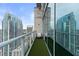 Private balcony featuring artificial turf and city views, perfect for relaxing and enjoying the scenery at 777 N Ashley Dr # 2601, Tampa, FL 33602