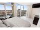 This bright bedroom boasts floor-to-ceiling windows with city views, elegant curtains, and a wall-mounted television at 777 N Ashley Dr # 2601, Tampa, FL 33602