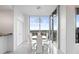 Bright dining area with floor to ceiling windows and modern light fixture at 777 N Ashley Dr # 2601, Tampa, FL 33602