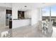 Open dining area with glass table and marble floors near kitchen and living area at 777 N Ashley Dr # 2601, Tampa, FL 33602