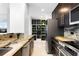 Kitchen with granite countertops, stainless steel appliances, and decorative shelving at 777 N Ashley Dr # 2601, Tampa, FL 33602