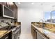 Kitchen with stainless steel appliances, granite counters and a breakfast bar at 777 N Ashley Dr # 2601, Tampa, FL 33602