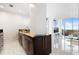 Modern kitchen with granite countertops and stainless steel appliances open to a spacious living room at 777 N Ashley Dr # 2601, Tampa, FL 33602