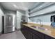 The stylish kitchenette features stainless steel appliances, granite countertops, and ample storage at 777 N Ashley Dr # 2601, Tampa, FL 33602