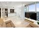 Open concept living area with fireplace, kitchen, dining and floor to ceiling windows at 777 N Ashley Dr # 2601, Tampa, FL 33602