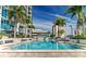 Beautiful pool surrounded by palm trees and lounge chairs, creating a relaxing outdoor oasis in the city at 777 N Ashley Dr # 2601, Tampa, FL 33602