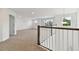 Spacious loft area with carpeted floor and large windows at 4939 Eagle Rock Dr, Wimauma, FL 33598