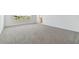 Bright main bedroom with large window and ensuite bathroom at 4939 Eagle Rock Dr, Wimauma, FL 33598