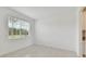 Spacious dining room with large window and neutral color palette at 4939 Eagle Rock Dr, Wimauma, FL 33598