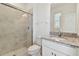 Bathroom with granite countertop, shower, and toilet at 4939 Eagle Rock Dr, Wimauma, FL 33598