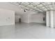 Two-car garage with epoxy flooring and ample storage space at 4939 Eagle Rock Dr, Wimauma, FL 33598