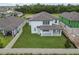 Aerial view of house and backyard, showing new construction nearby at 4939 Eagle Rock Dr, Wimauma, FL 33598