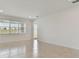 Bright and airy living room with tile floors and a large window at 4939 Eagle Rock Dr, Wimauma, FL 33598