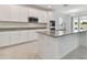 Modern kitchen with stainless steel appliances and granite countertops at 4939 Eagle Rock Dr, Wimauma, FL 33598