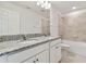 Modern bathroom with double vanity and a shower/tub combo at 4939 Eagle Rock Dr, Wimauma, FL 33598