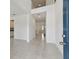 Bright and airy entryway with tile flooring and open staircase at 4939 Eagle Rock Dr, Wimauma, FL 33598