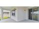 Covered back patio with sliding glass doors and a view of the backyard at 4939 Eagle Rock Dr, Wimauma, FL 33598