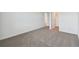 Simple bedroom with carpeted floors and an ensuite bathroom at 4939 Eagle Rock Dr, Wimauma, FL 33598