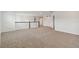 Spacious upstairs hallway with carpeted floors and ample natural light at 4939 Eagle Rock Dr, Wimauma, FL 33598