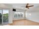 Bright, airy bedroom with ample natural light, a private balcony, and sleek ceiling fan at 111 N Albany Ave # 16, Tampa, FL 33606