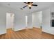 Bright bedroom with ceiling fan, wood-look floors, and multiple closet access at 111 N Albany Ave # 16, Tampa, FL 33606