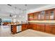 Spacious kitchen featuring wood cabinets with granite counters and stainless steel appliances at 111 N Albany Ave # 16, Tampa, FL 33606