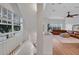 Open living space with wood flooring, ample natural light, and stylish staircase at 111 N Albany Ave # 16, Tampa, FL 33606