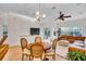 Spacious living room featuring an open floorplan, natural light, and adjacent dining area at 111 N Albany Ave # 16, Tampa, FL 33606