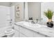 Bright bathroom featuring a single sink with marble countertops and a shower-tub combination at 814 Flash Dr, Clearwater, FL 33765