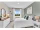 Bright bedroom featuring a comfy bed, natural light, and stylish decor at 814 Flash Dr, Clearwater, FL 33765