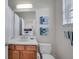 This bathroom is complete with a vanity, toilet, and linen closet that combine functionality and style at 3257 Mangrove Point Dr, Ruskin, FL 33570