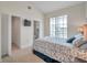 Bedroom with a vaulted ceiling, attached bath, closet, and a large window at 3257 Mangrove Point Dr, Ruskin, FL 33570