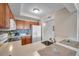 Bright kitchen with white countertops, wood cabinets, and stainless steel appliances at 3257 Mangrove Point Dr, Ruskin, FL 33570