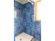 Shower with blue tile surround at 16308 Rock Lake Dr, Odessa, FL 33556