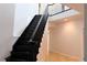 Elegant black staircase leading to the upper level at 16308 Rock Lake Dr, Odessa, FL 33556