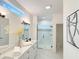 Elegant bathroom with double vanity, frameless shower, and marble floors at 17423 Metcalf Ave, Port Charlotte, FL 33954