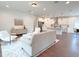 Open living room and kitchen with hardwood floors at 17423 Metcalf Ave, Port Charlotte, FL 33954