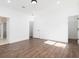 Bright bedroom with hardwood floors and access to bathroom and closet at 17423 Metcalf Ave, Port Charlotte, FL 33954
