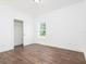 Spacious bedroom with wood floors and a large closet at 17423 Metcalf Ave, Port Charlotte, FL 33954