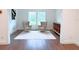 Light-filled office featuring hardwood floors and built-in shelving at 17423 Metcalf Ave, Port Charlotte, FL 33954
