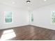 Bright bedroom with hardwood floors and large windows at 17399 Masten Ave, Port Charlotte, FL 33954