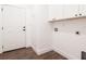 Laundry room with built-in cabinets and hardwood floors at 17399 Masten Ave, Port Charlotte, FL 33954